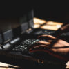 bigstock The Hacker Using His Laptop Co 369795574 scaled e1609430541279