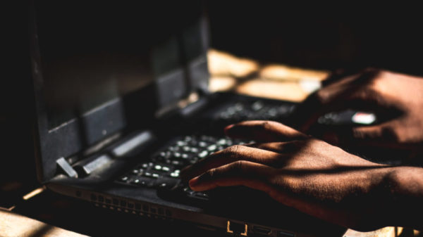 bigstock The Hacker Using His Laptop Co 369795574 scaled e1609430541279
