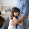 bigstock Unhappy Little Child Hug Leavi 304422565 scaled e1613439193720