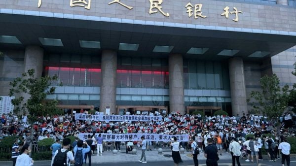China arrests hundreds over banking scandal that sparked rare protests