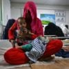 Misery and disease swept Afghanistan a year after Taliban rule