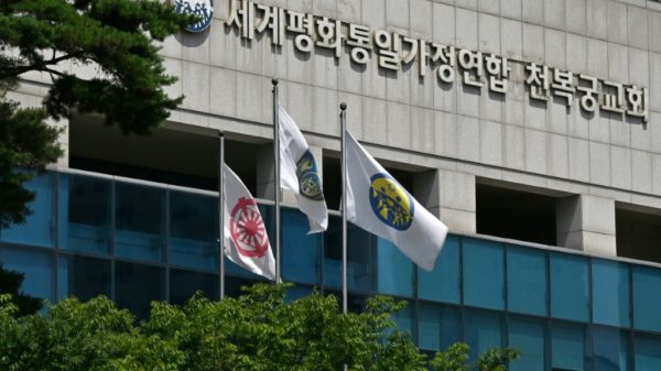Japans ruling party says half its MPs had Unification Church