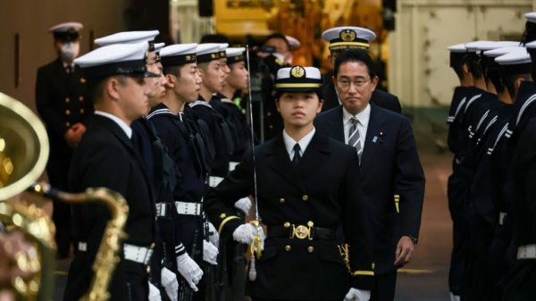 Japan PM pledges to boost military capacity